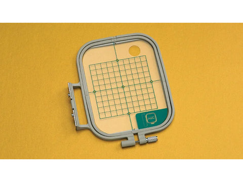 Medium embroidery hoop with a grid and an "ABC" label.