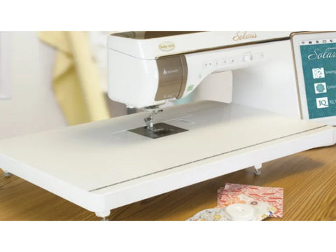 Baby Lock Solaris sewing machine with an attached extension table.