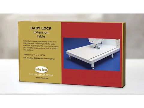 A Baby Lock extension table for sewing machines is shown in its packaging.