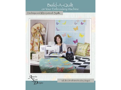Amelie Scott Designs Build-A-Quilt book with a woman using an embroidery machine.