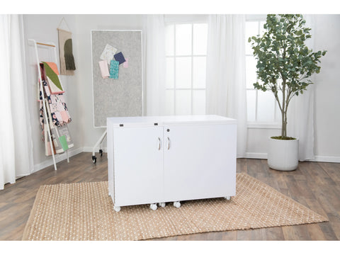 A white Koala All-In-One Embroidery Studio is on a rug in a bright room.