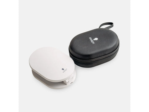 A white Foldi Go rechargeable table lamp next to its black zippered carrying case.