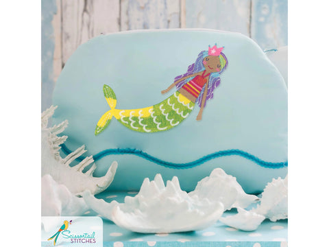 Light blue pouch with an embroidered mermaid, surrounded by white seashells.