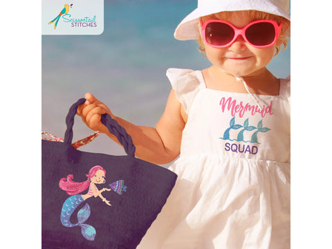 A young child in a white dress and pink sunglasses holds a dark bag with a mermaid design.