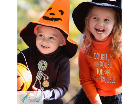 Two children in Halloween costumes, a boy in a mummy shirt and a girl in a witch hat.