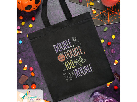 Black tote bag with "Double, Double, Toil and Trouble" embroidered design.