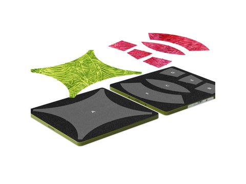 Two green and black fabric cutting dies are shown with cut fabric pieces in green and red.