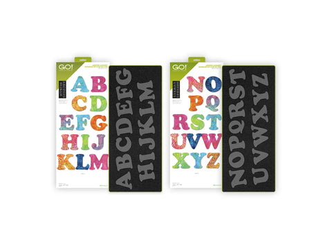 Two AccuQuilt GO! fabric cutting dies display the uppercase alphabet in a carefree font.