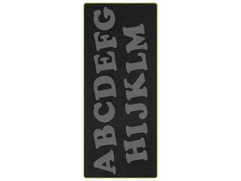 A black cutting mat with uppercase alphabet letters A through M in two rows.