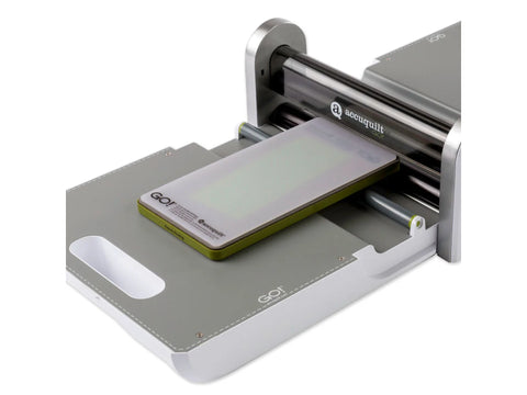 AccuQuilt GO! fabric cutter with a 5" x 10" cutting mat.