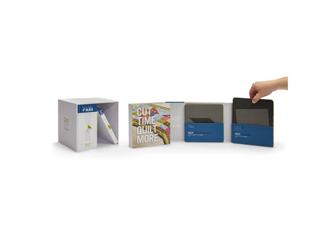 A white box containing eight GO! Dies, a cutting mat, and a pattern booklet.