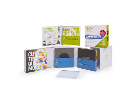 AccuQuilt Qube Companion Corners 4" set with books and dies.