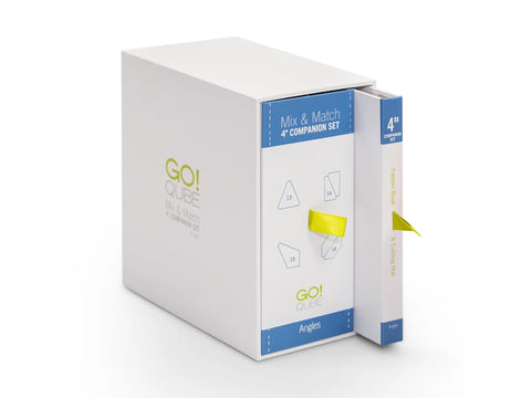 A white box with blue and green text, containing a "Mix & Match 4" Companion Set" and a "Pattern Book & Cutting Mat."