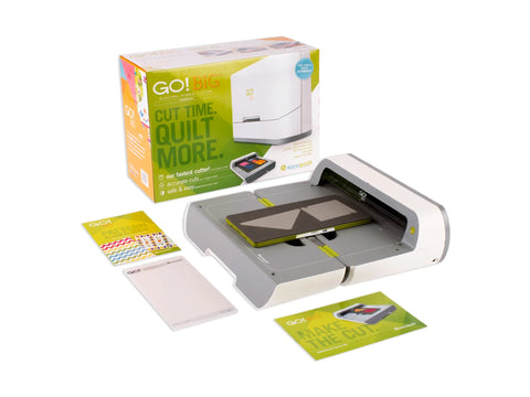 An AccuQuilt GO! Big Electric Fabric Cutter Starter Set is displayed with its box and accessories.
