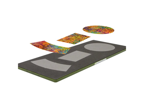 AccuQuilt die with three fabric pieces cut into hat shapes.