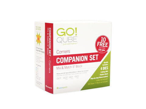 AccuQuilt Qube Companion Corners 5" set with 4 dies, cutting mat, and pattern book.