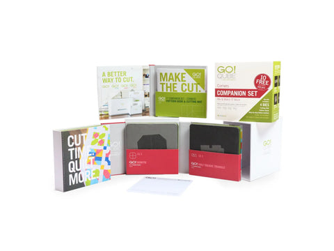 A collection of AccuQuilt Qube Companion Corners 5" sets and accessories.