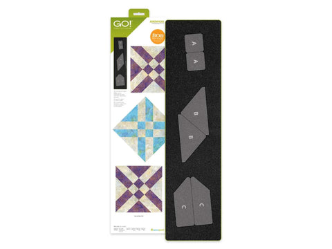 An AccuQuilt Arrowhead Die set with three different shaped cutting dies and example quilt patterns.