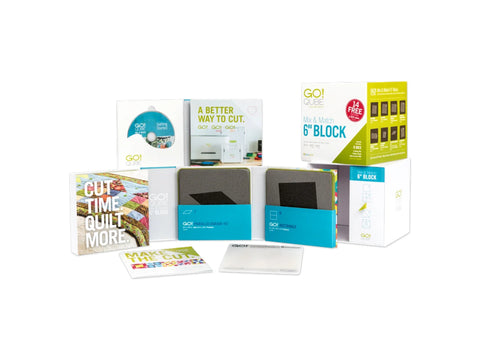 A collection of AccuQuilt GO! Qube Mix & Match 6" Block products, including dies and instructional materials.