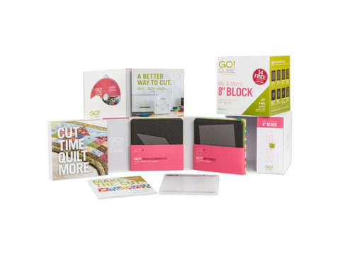 An AccuQuilt Qube Mix & Match 8" Block set with dies, mats, and instructional materials.