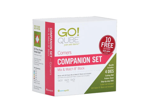 A white box for the AccuQuilt Qube Companion Corners 8" set, featuring red and green accents.