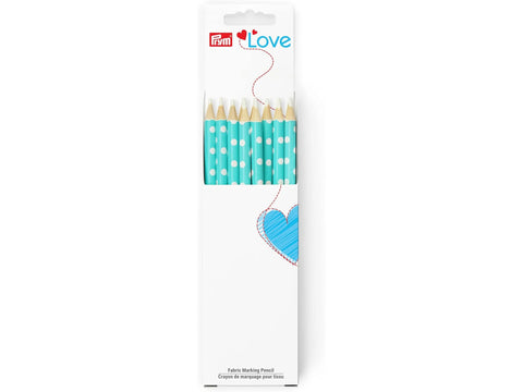 A package of turquoise fabric marking pencils with white polka dots and white leads.