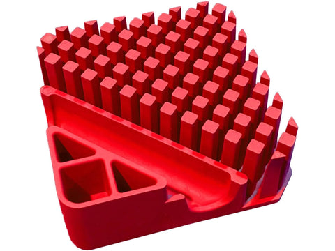A red organizer with many square-shaped compartments and a triangular side pocket.