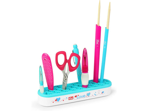 Prym Love Hold and Store Organizer with pink and blue sewing tools.