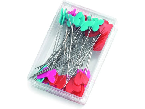 Fifty flat head pins with red hearts, turquoise, and pink butterflies are in a clear case.