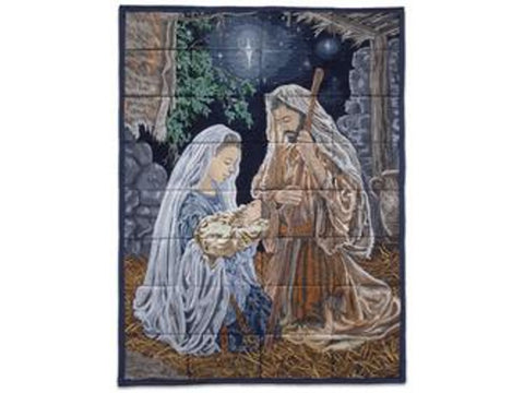 A tapestry depicting Mary, Joseph, and baby Jesus in a stable under a star-filled sky.