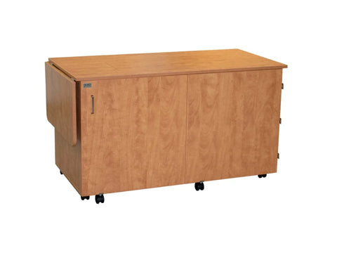 Horn 9050 sewing and embroidery cabinet with a bifold front door and hoop storage.