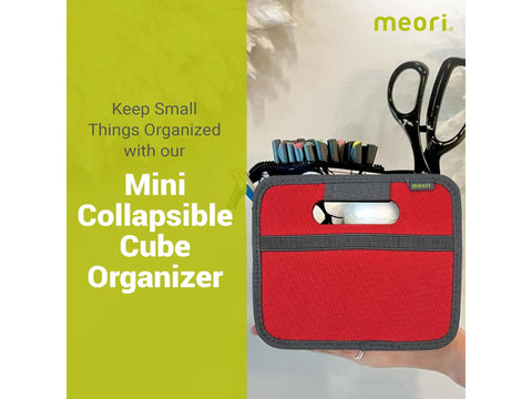 Red Meori mini collapsible cube organizer holding sewing supplies.