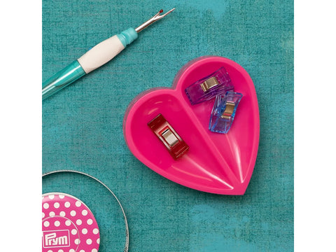 Prym Love Magnetic Heart Pin Cushion with a seam ripper and sewing clips.