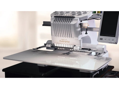 A white Baby Lock Enterprise embroidery machine with an extension table.