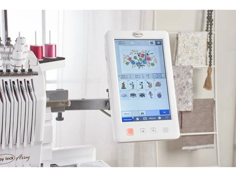 A white Baby Lock Array 6-needle embroidery machine displays a colorful floral design on its screen.