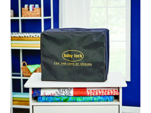 Black serger dust cover with "baby lock" logo and "FOR THE LOVE OF SEWING" text.