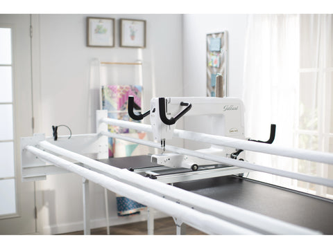 A white Baby Lock Gallant 15" long arm quilting machine on an 8' Villa frame.