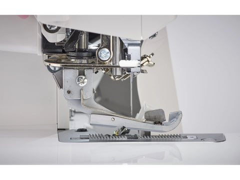 A close-up view of the Baby Lock Victory serger's needle and presser foot area.