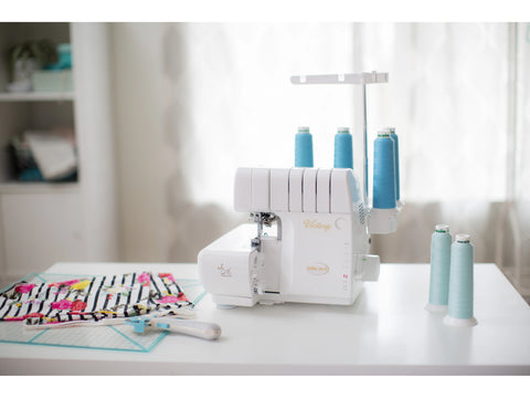Baby Lock Victory serger with Jet-Air Threading System and light blue thread.