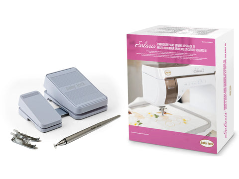 Baby Lock Solaris Embroidery & Sewing Upgrade 3 with foot pedals, stylus, and presser foot.