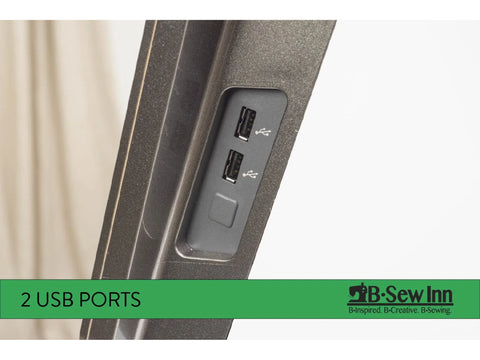 A close-up shows two USB ports on the side of a dark gray sewing machine.