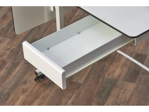 An open white drawer extends from a quilting machine on a wooden floor.