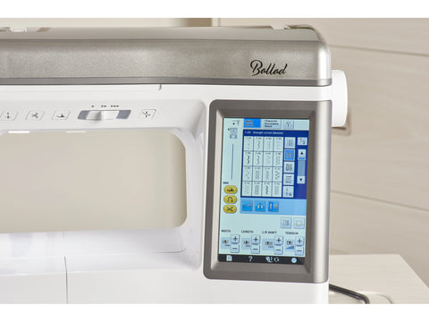 A Baby Lock Ballad sewing and quilting machine with a digital display.