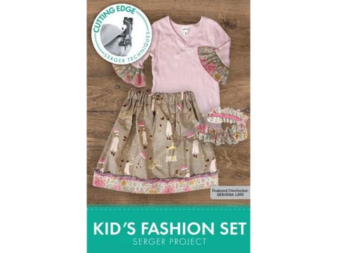 A pink long-sleeved shirt with patterned cuffs and a patterned skirt with a ruffled waistband.