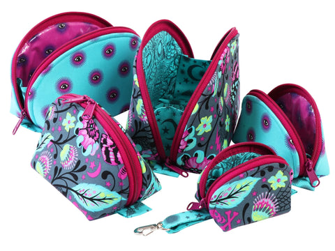 A collection of five zippered bags in varying sizes, featuring floral and eye patterns.