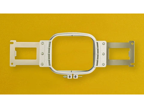 A white 4x4 inch multi-needle embroidery frame on a yellow background.