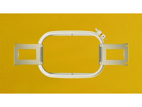 A white multi-needle embroidery frame with metal arms is centered on a yellow background.