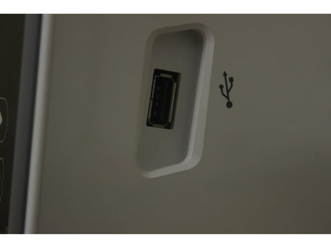 A close-up of a USB port on a Brother Innovis 2750D sewing machine.