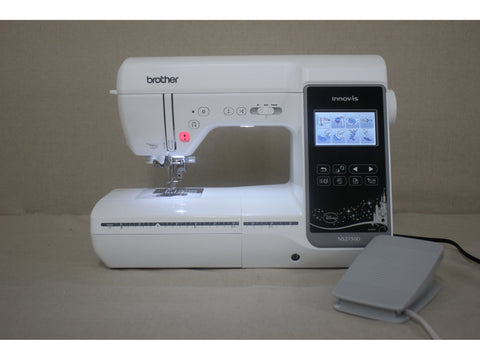 A white Brother Innov-is 2750D sewing and embroidery machine with a foot pedal.