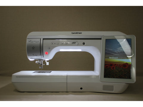 A white Brother Luminaire Innov-is XP1 sewing and embroidery machine with a touchscreen.